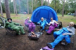 Group in their all in one sleeping bags at Burnbake campsite Dorset